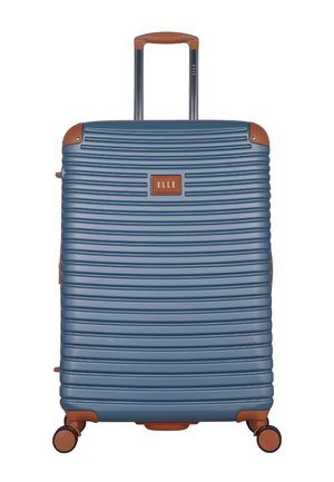 Blue hard-shell suitcase with horizontal ridges, brown accents, four spinner wheels, and a retractable handle extended.