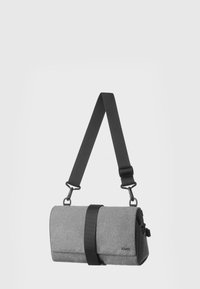 Gray textured fabric bag with a cylindrical shape, a black adjustable strap, and a prominent black buckle accent.