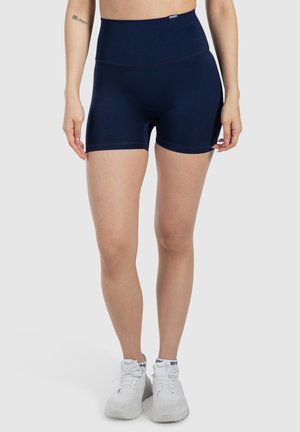 Pantalones cortos deportivos de tiro alto en azul marino, fabricados con un tejido elástico; cuentan con una textura suave y un diseño ajustado con costuras mínimas.