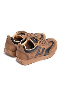 Brown suede sneakers with black leather accents, round toe, thick rubber sole, and brown laces. Features a logo on the side.