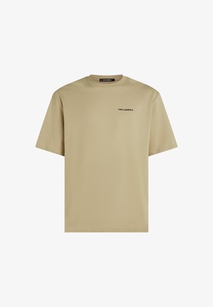 Beige pamut póló kerek nyakkal és rövid ujjakkal. Bal mellen fekete nyomtatott "KARL LAGERFELD" logó található. Egyszerű dizájn.