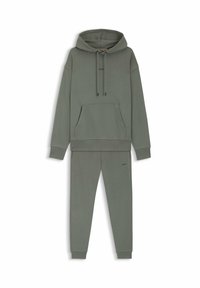 Green hooded sweatshirt with a front pocket and matching sweatpants. Crafted from soft fabric featuring a minimal logo on the chest and leg.
