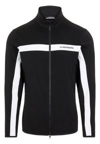 Veste noire à zip avec des manches longues, ornée de rayures blanches horizontales sur la poitrine et le long des manches, fabriquée dans un tissu lisse.