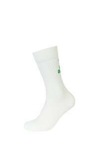 Calzino bianco di cotone con texture a coste e lunghezza a crew. Presenta testo verde lungo il lato. Finitura liscia senza ulteriori motivi.