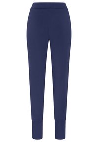 Mörkblå joggingbyxor i mjukt tyg, med en avsmalnande design, elastisk midja och åtsittande manschetter vid anklarna.