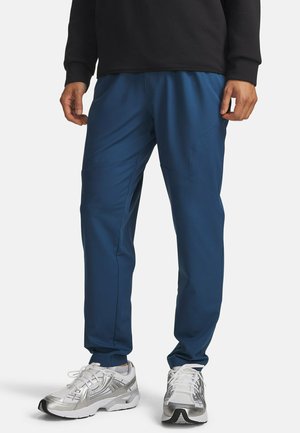 UA UNSTOPPABLE TAPERED - Trainingsbroek - wham blue