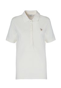 Polo in cotone bianco sporco con colletto classico, maniche corte, chiusura a cinque bottoni e un piccolo logo ricamato sul lato sinistro del petto.