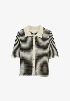 Cardigan a maniche corte in maglia a righe bianco e nero con colletto color crema, pattina con bottoni e orlo e maniche smerlate.