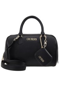 Sac à main noir Guess avec double poignée, bandoulière amovible et petite pochette assortie attachée par une chaîne dorée.