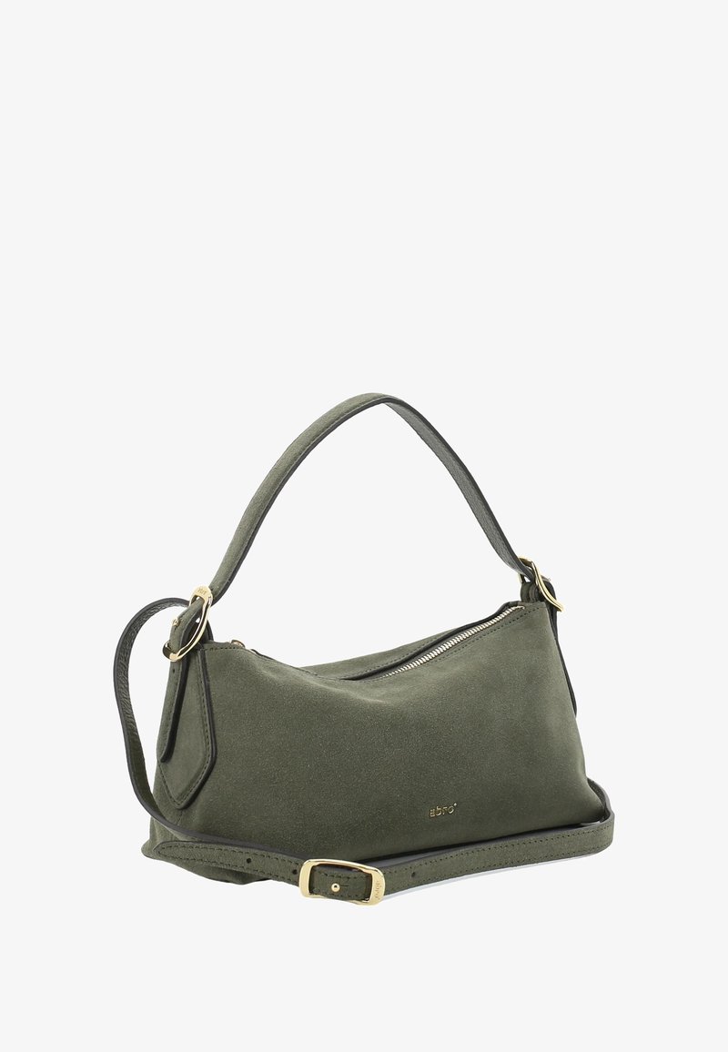 Olivgrünes Wildlederhandtasche mit geschwungener Form, goldfarbener Hardware und abnehmbarem Tragegurt. Reißverschluss oben und minimalistisches Design.