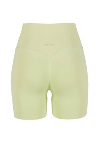 Hoge taille, lichtgele shorts van zacht, rekbaar stof. Heeft een geribde tailleband en een naadloos ontwerp voor comfort.