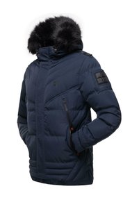 Mörkblå puffjacka med en huva av fuskpäls, dragkedjefickor och en lätt vadderad design. Har en accentpatch på ärmen.