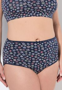Námořnická květinová spodní prádlo set s malými, barevnými květinami, přiléhavým střihem a mašlí na pase. Měkká textilie.