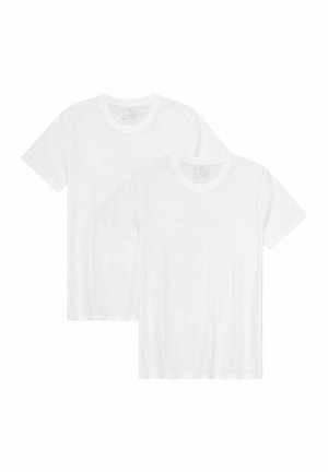 Dos camisetas blancas lisas de manga corta y cuello redondo, una ligeramente superpuesta sobre la otra, sobre un fondo blanco.