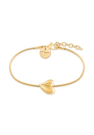 Gold-tone bracelet with a flexible chain, featuring a heart-shaped charm and a circular clasp with a small design detail.