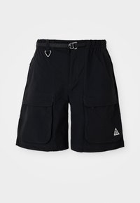 Black cargo shorts with elastic waistband, integrated belt, large side pockets, and triangle ACG logo on right leg.