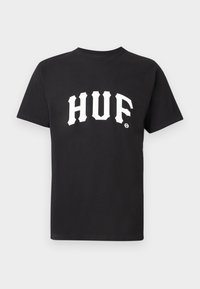 Fekete pamut póló, amelyen merész, fehér "HUF" logó található, kollegiális betűtípussal a mellkasán. Rövid ujjú és kerek nyakú.