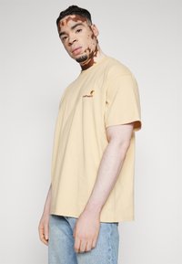 Carhartt WIP AMERICAN SCRIPT - T-shirt basic - rattan