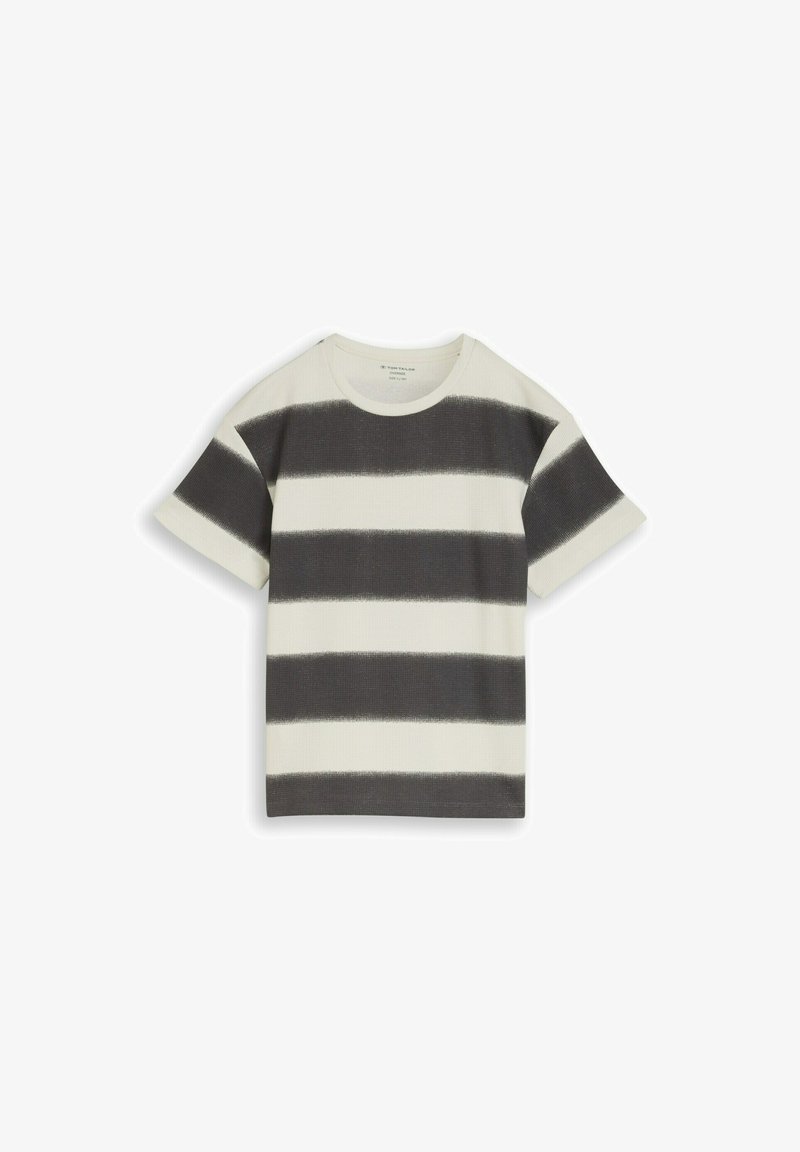 T-shirt tricoté à manches courtes avec larges rayures horizontales noires et blanches et un col rond sur un fond blanc.