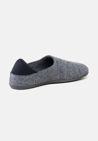 Gray felt slipper with a black fabric heel accent, rounded shape, slip-on design, and a textured upper. Soft texture, flat rubber sole.