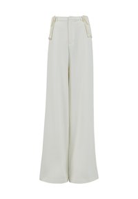 Pantalones de pierna ancha en color crema, con una tela suave, cintura alta y bolsillos laterales con detalle de piping en contraste.