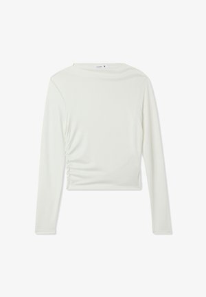 Top bianco a maniche lunghe con scollatura rotonda e arricciature laterali, realizzato in tessuto morbido. Lunghezza crop con cuciture minime.