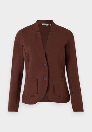 Bruine op maat gemaakte blazer van ribbelstof, met een opstaande kraag, twee voorzakken en een sluiting met twee knopen.