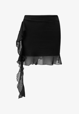 Schwarze, taillierte Rock, der asymmetrisch von der Taille bis zum Saum mit einem transparenten Rüschendetail drapiert ist. Glatte Textur.