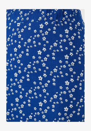 Blue fabric with a textured surface featuring scattered white flowers and black dot centers, creating a floral pattern across the material.