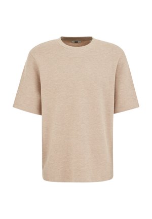 T-shirt beige en maille texturée à manches courtes avec un col rond et une coupe décontractée, présenté sur un fond blanc.