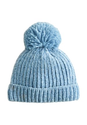 Light blue knitted winter hat with a folded brim and a large pom-pom on top, made of soft, textured yarn.