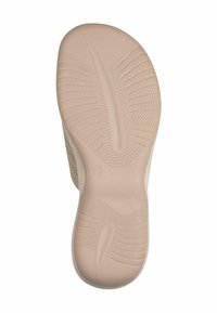 Semelle de chaussure beige clair avec surface en caoutchouc texturé et motifs en vagues. Présente un léger talon et un marquage de taille "37" près du talon.