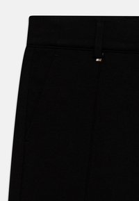 BOSS Kidswear TROUSERS - Hlače - black