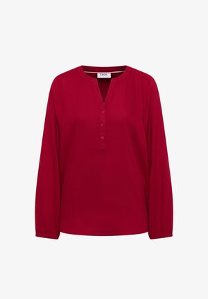 Blusa rossa a maniche lunghe con scollatura a V, bottone frontale e polsini elasticizzati. Tessuto liscio di colore uniforme. Marchio: CECIL.