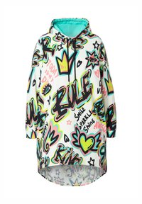 Pull à capuche oversized blanc avec des motifs de graffiti colorés comprenant des cœurs, des couronnes et des étoiles. Dispose d'un ourlet arrondi et de cordons de serrage.