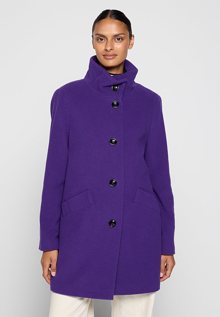 Purple wool coat featuring a high collar, six black buttons, and two side pockets. Smooth texture with a tailored fit.