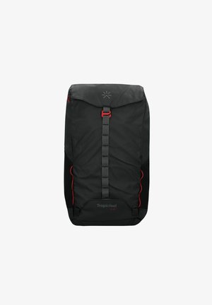 Black backpack with a fold-over top, red accents, adjustable straps, and a textured finish. Features a logo and side pockets for storage.