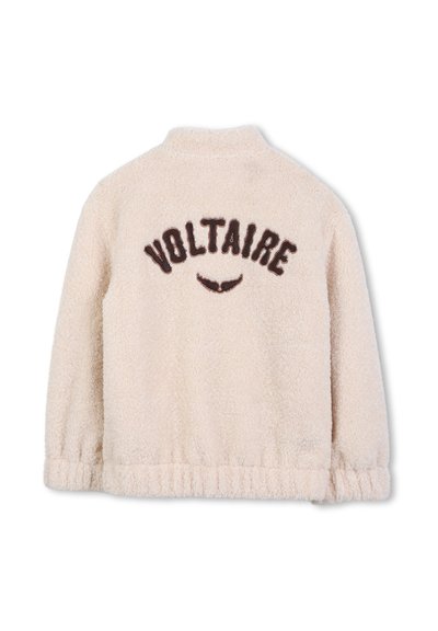 Cream-colored fleece jacket with a high collar, ribbed hem, and "VOLTAIRE" in brown embroidery on the back. Soft, textured fabric.