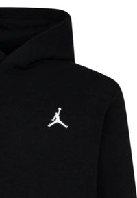 Felpa nera con cappuccio in misto cotone, presenta il logo Jumpman bianco sul petto. Tessuto liscio con tasca a marsupio frontale e cappuccio regolabile con cordino.