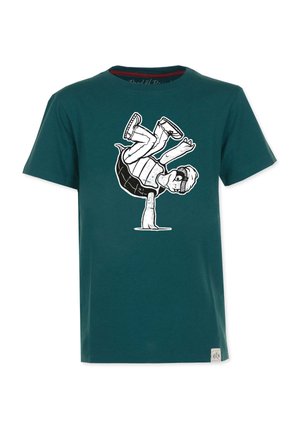 Teal bomuld t-shirt med et sort-hvidt grafik af en dreng, der balancerer på en skildpadde. Korte ærmer og rund hals design.