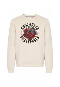 Cream-colored sweatshirt featuring a graphic of a panda riding a bicycle, with the text "OBSTACLES ARE THE CHALLENGES" in bold black font.