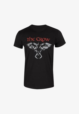 Černé tričko s grafickým motivem vrány a textem "The Crow" červenou barvou, kulatý výstřih, krátké rukávy, bavlněný materiál.