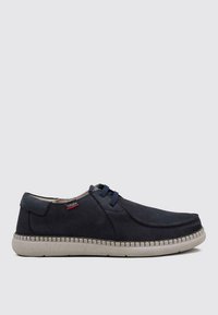 Chaussures en cuir bleu marine avec un bout arrondi, des détails cousus, des lacets élastiques et une semelle en caoutchouc gris clair.