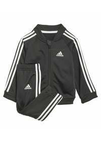 Survêtement noir en matériau lisse, avec des accents à trois bandes blanches sur les manches et le pantalon, comprenant une veste zippée et une taille élastique.
