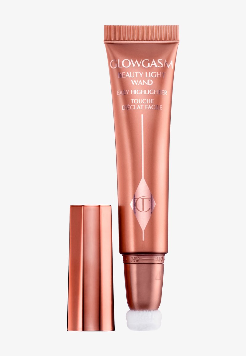 Tube aus roségoldenem Glowgasm Beauty Light Wand Highlighter mit abgenommenem Deckel, der die weiche Applikatorspitze zeigt.