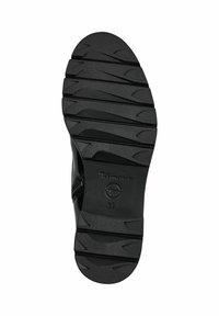 Semelle de chaussure en caoutchouc noir avec un motif de grip texturé, comportant un logo bien visible et l'imprimé de la taille 37 sur le côté.