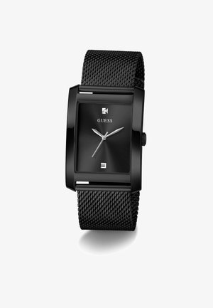 Schwarze Guess Uhr mit rechteckigem Gehäuse, schwarzem Mesh-Armband, minimalistischem Ziffernblatt, silbernen Stunden- und Minutenzeigern sowie quadratischen Stundenmarkierungen.