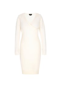 Valkoinen neulemekko, jossa on V-pääntie, pitkähihaiset hihat ja koristeelliset hartiat, joissa on pieniä helmiä. Muotoiltu design, joka kapenee reiden puoliväliin.