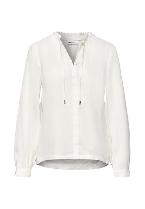 Biała bluzka z długim rękawem, z falbaniastego kołnierzem, dekoltem w serek z troczkami, zapinanymi mankietami i lekko zaokrąglonym dołem.