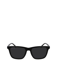 Ochelari de soare dreptunghiulari negri cu lentile închise, având un cadru din plastic neted și templesuri ușor curbate. Logo-ul Lacoste este afisat pe cadru.